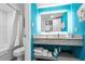 Bathroom with a mirror, updated fixtures, and bright blue walls at 7200 N Ocean Blvd. # 662, Myrtle Beach, SC 29572