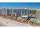 Beachfront view of the resort towers, pools, and amenities on a sunny day at 7200 N Ocean Blvd. # 662, Myrtle Beach, SC 29572