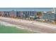 Expansive beachfront view featuring resort buildings, sandy beach, and ocean waves at 7200 N Ocean Blvd. # 662, Myrtle Beach, SC 29572