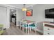 Cozy dining area with a table and four chairs, adjacent to the kitchen and equipped with modern amenities at 7200 N Ocean Blvd. # 662, Myrtle Beach, SC 29572