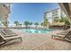 Outdoor pool with lounge chairs and beach bar at 7200 N Ocean Blvd. # 662, Myrtle Beach, SC 29572