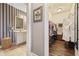 Bathroom featuring a vanity area next to a walk-in closet for convenience and storage at 730 Pickering Dr. # 201, Murrells Inlet, SC 29576