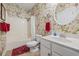 Bright bathroom with tub and shower, floral wallpaper, and sink vanity at 730 Pickering Dr. # 201, Murrells Inlet, SC 29576