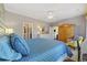Bright bedroom features a ceiling fan, large windows, and neutral walls for a relaxing ambiance at 730 Pickering Dr. # 201, Murrells Inlet, SC 29576