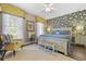 Comfortable bedroom features stylish wallpaper, a plush bed, and bright natural light at 730 Pickering Dr. # 201, Murrells Inlet, SC 29576
