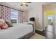 Inviting bedroom featuring a comfortable bed, window view and decorative curtains at 730 Pickering Dr. # 201, Murrells Inlet, SC 29576