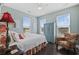 Charming bedroom featuring natural light, wood floors, and unique decor at 730 Pickering Dr. # 201, Murrells Inlet, SC 29576