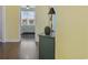 Hallway view into a bedroom featuring wood-look flooring and natural light at 730 Pickering Dr. # 201, Murrells Inlet, SC 29576
