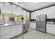 Spacious kitchen showcasing stainless steel appliances and a view to dining area at 730 Pickering Dr. # 201, Murrells Inlet, SC 29576