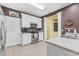 Well-lit kitchen with white cabinetry, stainless steel appliances, and stylish countertops at 730 Pickering Dr. # 201, Murrells Inlet, SC 29576