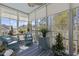 Charming sunroom with large windows offering views of the surrounding landscape and outdoor living at 730 Pickering Dr. # 201, Murrells Inlet, SC 29576