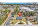 Aerial view of a brick home with fenced yard and driveway near the ocean at 7714 Woodland Dr., Myrtle Beach, SC 29572