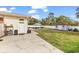 Large backyard with concrete patio, shed, white privacy fence and open lawn area at 7714 Woodland Dr., Myrtle Beach, SC 29572