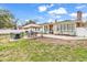 Expansive backyard featuring dual patios, outdoor seating, grilling area, and well-maintained lawn at 7714 Woodland Dr., Myrtle Beach, SC 29572