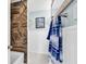 Stylish bathroom with a marbled tile shower and modern white wainscoting at 7714 Woodland Dr., Myrtle Beach, SC 29572