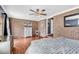 Bedroom features brick wall, ceiling fan, and stylish decor at 7714 Woodland Dr., Myrtle Beach, SC 29572