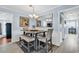 Cozy dining area with a modern table and bench seating, complemented by stylish decor and lighting at 7714 Woodland Dr., Myrtle Beach, SC 29572