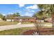 Charming brick home featuring a well-manicured lawn and a classic, welcoming facade at 7714 Woodland Dr., Myrtle Beach, SC 29572