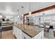 Open-concept kitchen and living room with a large granite island and stainless steel appliances at 7714 Woodland Dr., Myrtle Beach, SC 29572