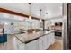 Bright, open kitchen with granite countertops, stainless steel appliances and an adjacent living space at 7714 Woodland Dr., Myrtle Beach, SC 29572