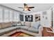 Inviting living room featuring a comfortable sectional sofa, bright light, and lots of natural light at 7714 Woodland Dr., Myrtle Beach, SC 29572