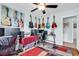 Office space featuring a guitar-themed decor, multiple monitors, and a ceiling fan at 7714 Woodland Dr., Myrtle Beach, SC 29572