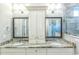 Bathroom featuring granite countertop double vanity, two mirrors and modern light fixtures at 8053 Laurel Ash Ave., Myrtle Beach, SC 29572