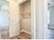 Open closet with a wood shelf and hardwood flooring at 8053 Laurel Ash Ave., Myrtle Beach, SC 29572