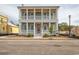 Charming two-story home features double balconies, a covered front porch, and classic architectural details at 8053 Laurel Ash Ave., Myrtle Beach, SC 29572