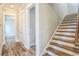 Spacious hallway with hardwood floors leading to stairs at 8053 Laurel Ash Ave., Myrtle Beach, SC 29572