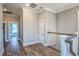 Upstairs hallway with hardwood floors and a white railing at 8053 Laurel Ash Ave., Myrtle Beach, SC 29572