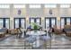 Bright lobby with high ceilings, stylish seating, and nautical-themed artwork creating a welcoming atmosphere at 8053 Laurel Ash Ave., Myrtle Beach, SC 29572
