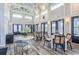 Open lobby featuring high ceilings, elegant lighting, and comfortable seating around tables at 8053 Laurel Ash Ave., Myrtle Beach, SC 29572