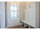 Mudroom featuring built-in bench with storage, beadboard, and coat hooks at 8053 Laurel Ash Ave., Myrtle Beach, SC 29572