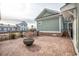 Outdoor patio featuring a modern fire pit, brick pavers, and new home construction at 8053 Laurel Ash Ave., Myrtle Beach, SC 29572