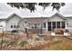 Spacious backyard featuring a patio with outdoor furniture, flower beds, and privacy at 807 Lalton Dr., Conway, SC 29526