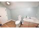 Clean, minimalist bathroom with a toilet, a vanity, and a white door at 807 Lalton Dr., Conway, SC 29526