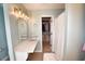Bathroom vanity with gold accents, spacious countertop, and walk-in closet at 807 Lalton Dr., Conway, SC 29526