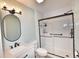 Modern bathroom with black fixtures, a sleek glass-enclosed shower and decorative mirror at 807 Lalton Dr., Conway, SC 29526