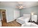 Bedroom featuring a ceiling fan, a large window, and a view into the bathroom at 807 Lalton Dr., Conway, SC 29526