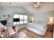 Bedroom features a vaulted ceiling, large window, desk, and a comfortable bed at 807 Lalton Dr., Conway, SC 29526