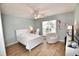 Bedroom featuring a ceiling fan, a large window, and charming decor at 807 Lalton Dr., Conway, SC 29526