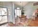 Elegant dining area with chandelier and hardwood floors filled with natural light from a large window at 807 Lalton Dr., Conway, SC 29526