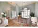 Charming entryway and dining area with hardwood floors, chandelier and lots of natural light at 807 Lalton Dr., Conway, SC 29526