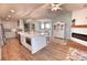 Open kitchen with large island, fireplace and views into dining and living areas at 807 Lalton Dr., Conway, SC 29526