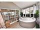 Enclosed sunroom features a hot tub, sliding glass doors and natural light at 807 Lalton Dr., Conway, SC 29526