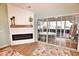 View of hot tub from sunroom with fireplace, wood mantel and sliding glass doors at 807 Lalton Dr., Conway, SC 29526