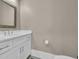 Bathroom with white vanity, mirror, commode and neutral color scheme at 823 Waterton Ave., Myrtle Beach, SC 29579