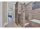 Modern bathroom with tiled shower and view into adjacent bedroom at 823 Waterton Ave., Myrtle Beach, SC 29579