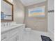 Well-lit bathroom with a white vanity, commode and a shower/tub combination at 823 Waterton Ave., Myrtle Beach, SC 29579